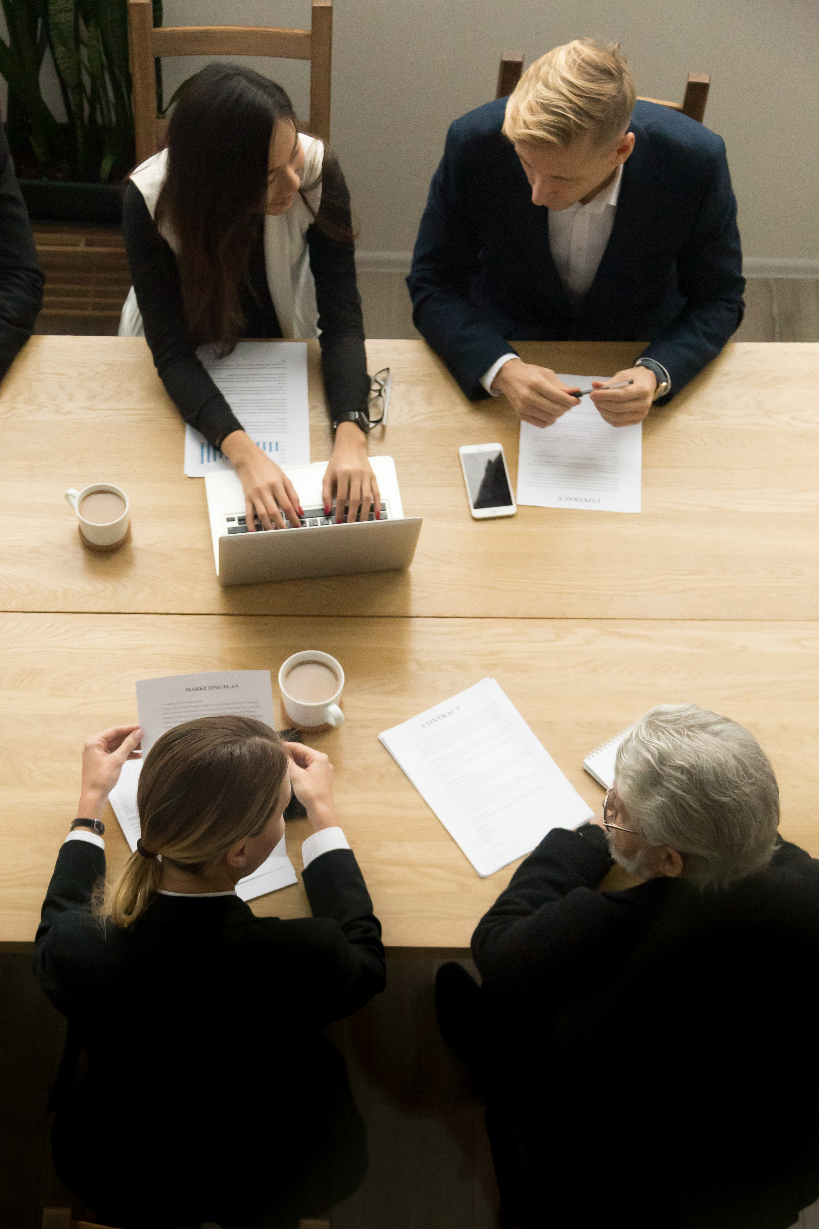 Legal professionals collaborating over case documents